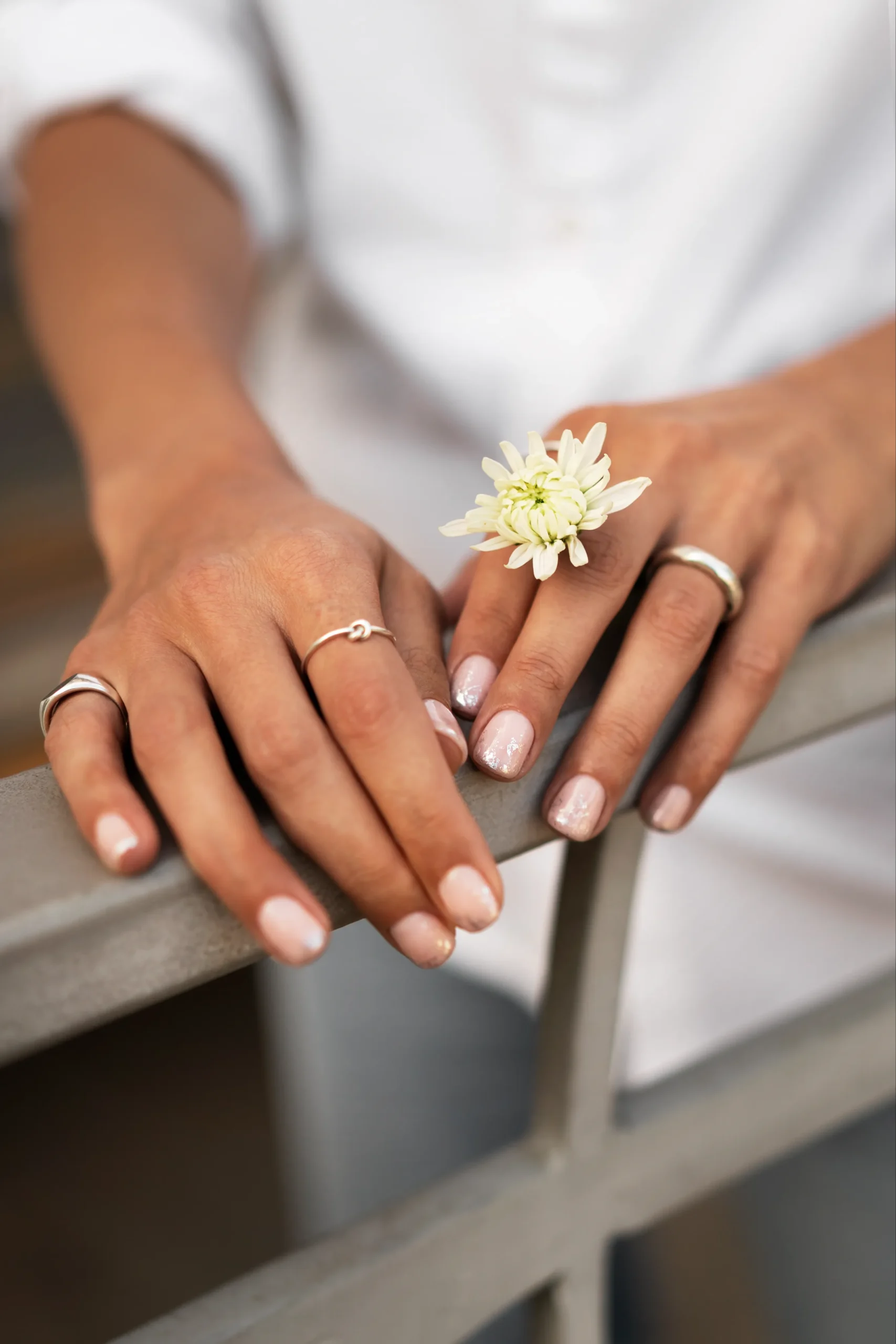 woman-showing-her-nail-art-fingernails-with-flower (1)